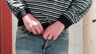 Man is pissing at restroom