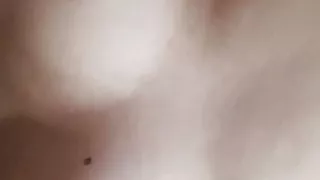 Dancing tits while lying in bed