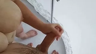 sexy step mom with big tits jerks off a cock in the shower