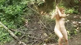 Nude girl rope swing at forest