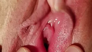 playing and filming as she strokes her clit