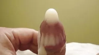 A very huge cum shot in a condom.