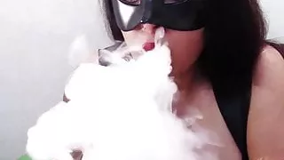 Busty Brunette in Black Mask Sucks Dildo, Masturbates