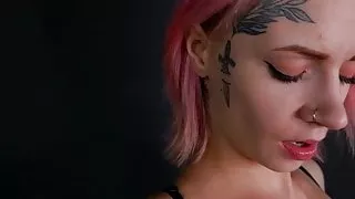 Girl with a tattoo on her face, playing with her pussy