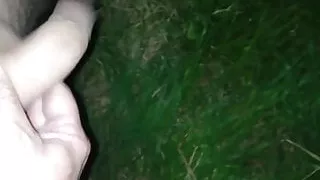 Wanking at night in field