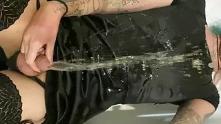 Goth trans girl peeing herself all over black silk dress