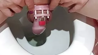 Sissy Lucy Pissing through her chastity cage