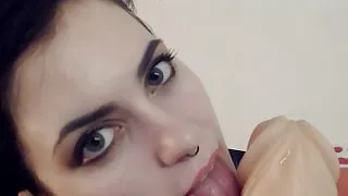 StacyMoon is sucking and licking a giant dildo