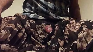 Wanking in pleated floral skirt and cum