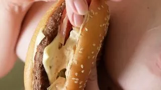 fuck burger. the girl jerks off the guy's dick with a burger