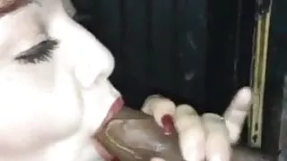 Slut wife sucking BBC at glory hole