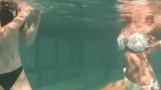 Hot chicks Irina and Anna swim naked in the pool