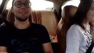 Girl jerks off a guy and masturbates herself while driving