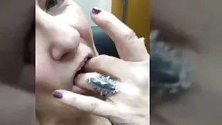 Granny fingers her pussy and tastes her sweet juice privately