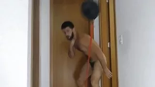 hot skilled fighter punches bag naked