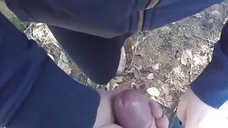 Amateur wanking him off in the woods