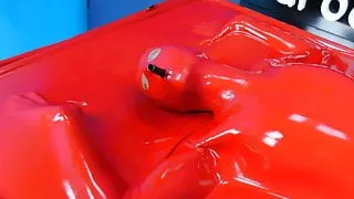 Bondage in Red Latex Vacbed with Attached Latex Mask