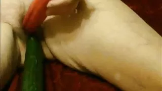 Mature slut sue using veg as sex toys