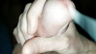 Milky semen squirts out of the plump glans