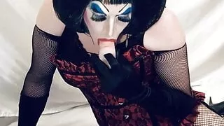 Horny Heavy makeup slut sucks and deep throats dildo