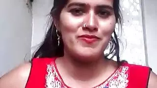 Girl in a red dress shows her boobs