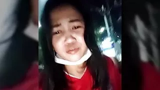 Thai cam girl has a piss on public street.