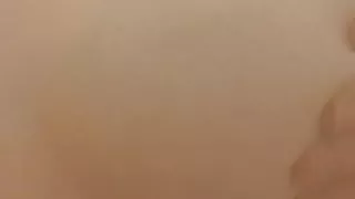 Busty babe in shower