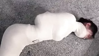 Mummified Asian girl struggles and hops