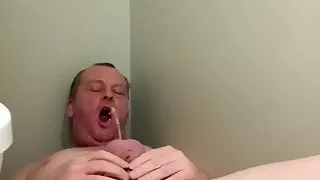 Caged cock pissing in mouth