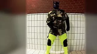 Pawing off in camo painter's overall and hi-viz waders