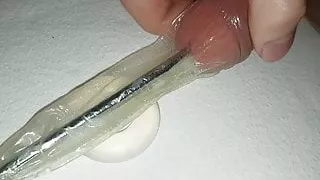 Urethral Sounding inside a condom, with cockring