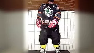 Rubber hockey pup pawing off