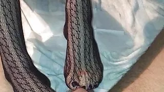 Fishnet stockings footjob