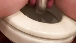 Slave in chastity on the toilet