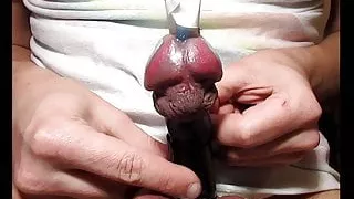 Tying and untying cock cbt