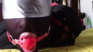 Laura XXX is wearing panthyhose and high heels. She's hogtie