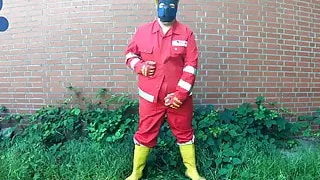 Worker Pup pawing off in red and yellow workgear