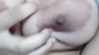 Busty girl fingering pussy