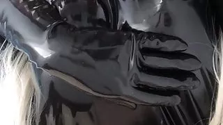 Rubber Doll in Latex Prison Chilling in Bed