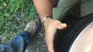 On his knees sucking a group outside