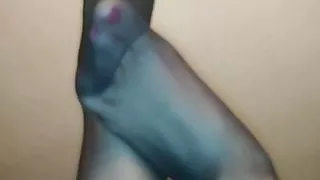 She playing with her beautiful feet