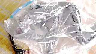 Cute Latex girl on vacuum bag and mask, breathplay