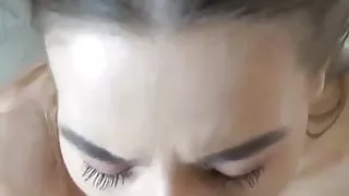 Gorgeous green eyed brunette sucking cock (who is she?)