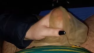 my wife in the car at a meeting in stockings makes a footjob