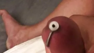 Cumming with a cock plug inserted