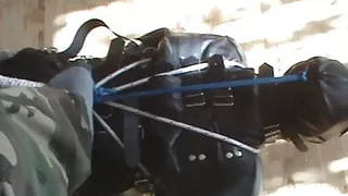 Slave hogtied in the straitjacket