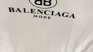 Finishing pissing on her Balenciaga t-shirt