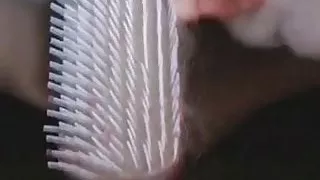 tight slut fingers her pussy with a brush