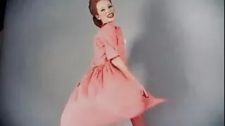 Vintage style, redhead in stockings does striptease