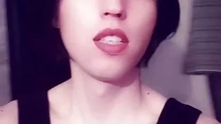 Dinara Artenysova short posing in front of camera